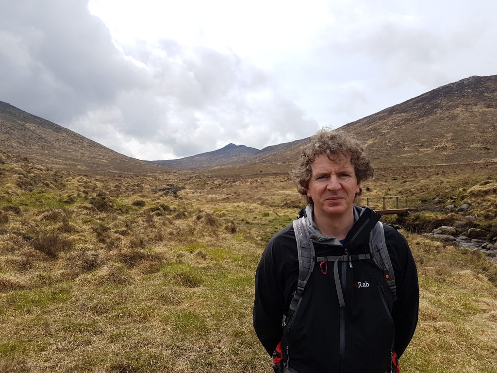Michel McMullan in a field