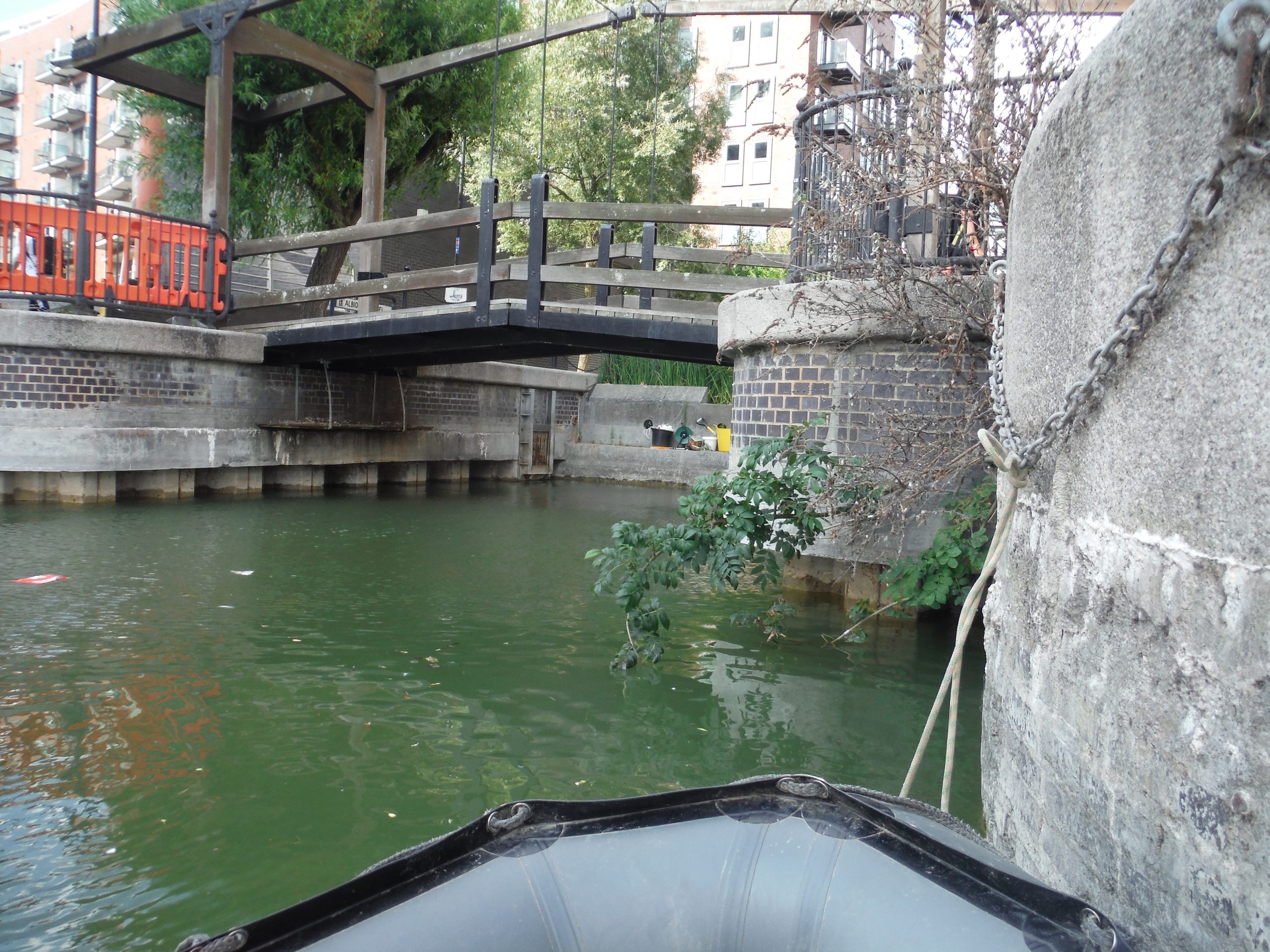 Wide shot of the existing bridge with regeneration works in progress, highlighting the dock’s aquatic environment